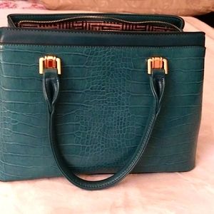 Ladies handbag, blue green in color, mostly for formal outing